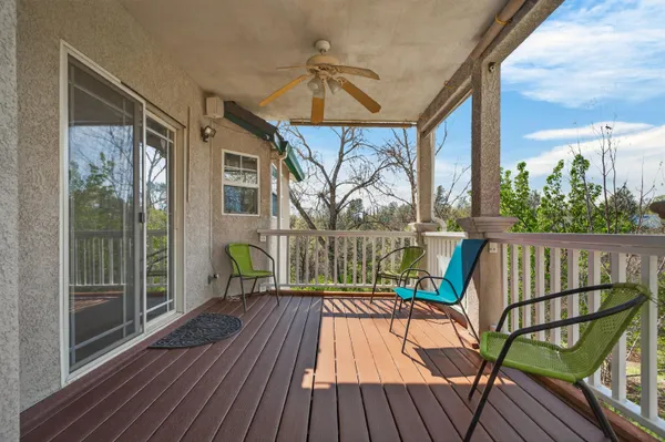 a view of balcony with furniture and wooden deck