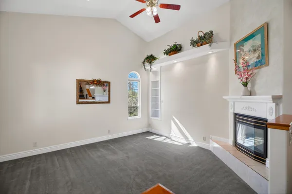 a view of livingroom with furniture and ceiling fan