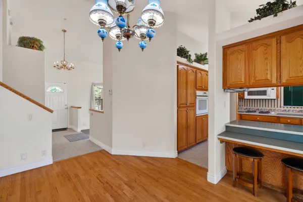 a view of an entryway with wooden floor