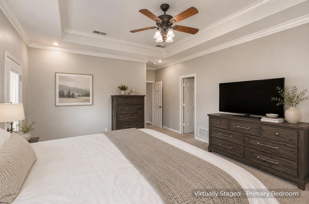 15 Trail Ridge Drive Melissa, TX 75454 - Photo 19 of 38 a bedroom with a bed and a flat screen tv