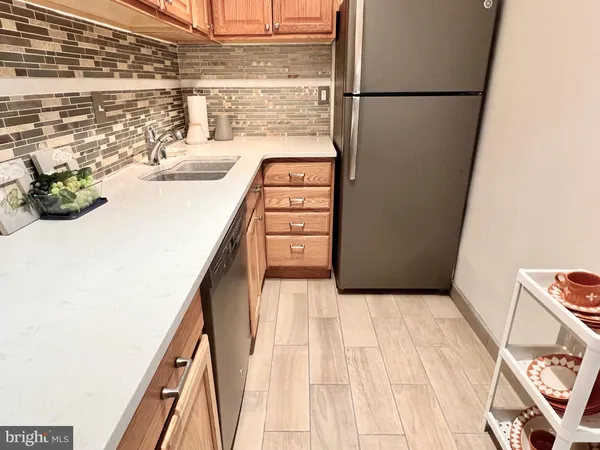a view of kitchen and wooden floor