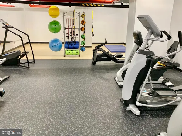 a view of entryway hall with furniture and a window