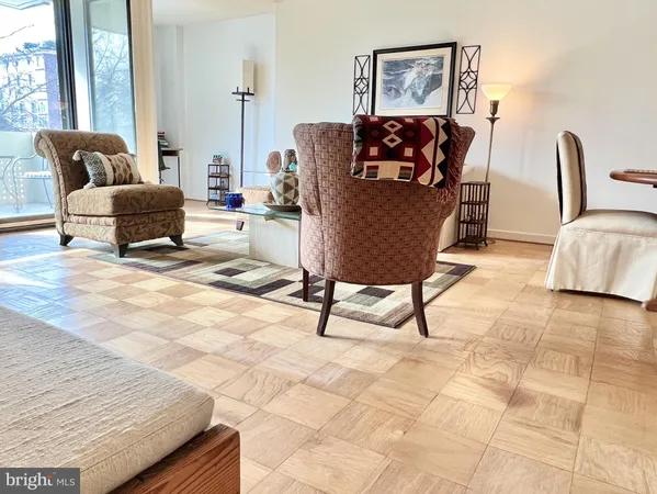 a living room with furniture and a rug