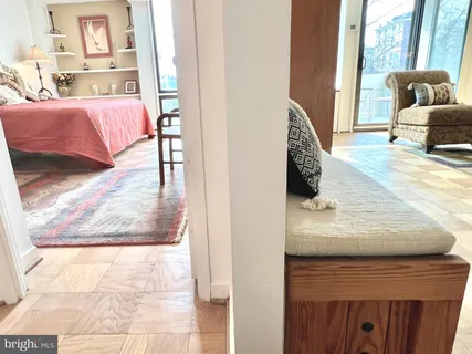 a view of living room with furniture and window