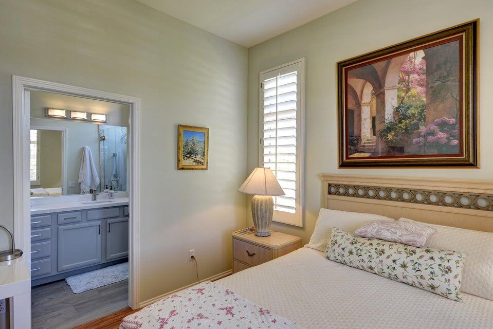 35841 Rosemont Drive Palm Desert, CA 92211 - Photo 11 of 22 a bedroom with a bed and a painting on the wall