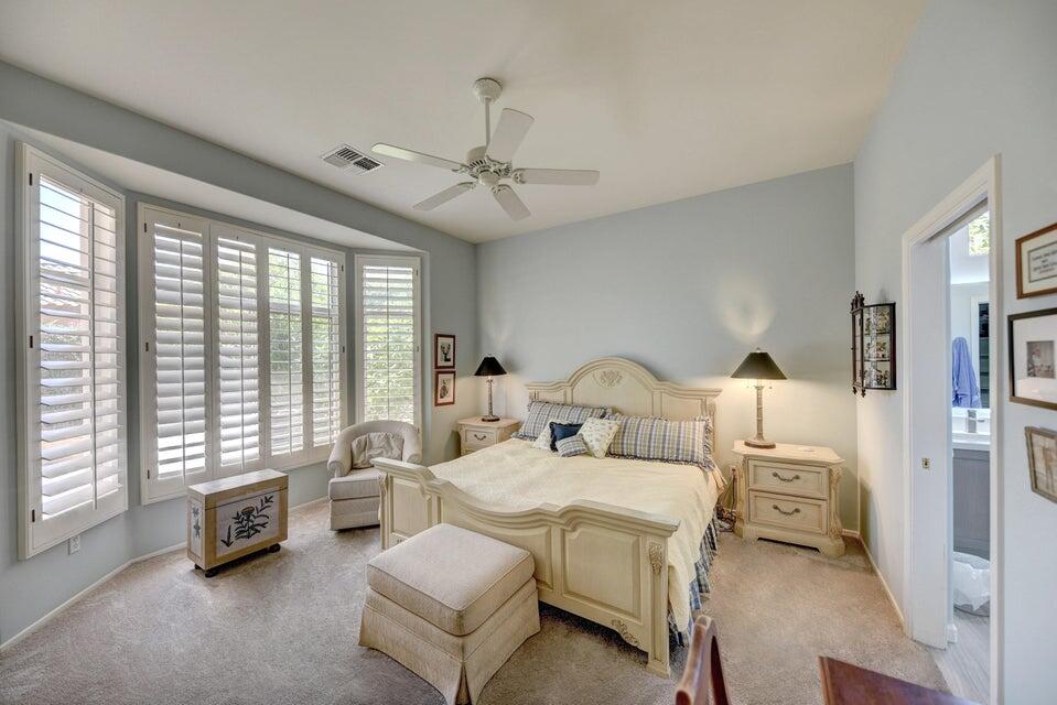 35841 Rosemont Drive Palm Desert, CA 92211 - Photo 13 of 22 a spacious bedroom with a bed a couch and large window