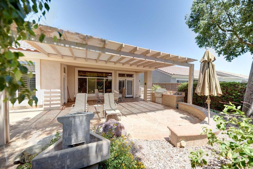 35841 Rosemont Drive Palm Desert, CA 92211 - Photo 20 of 22 a view of a patio with couches chairs and potted plants