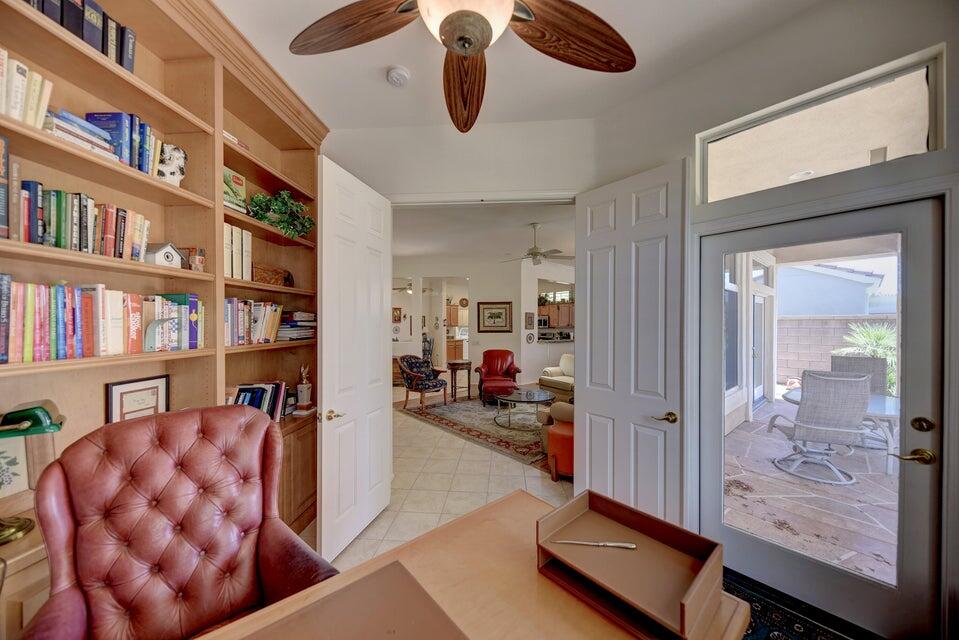 35841 Rosemont Drive Palm Desert, CA 92211 - Photo 4 of 22 a room with lots of books and a large window