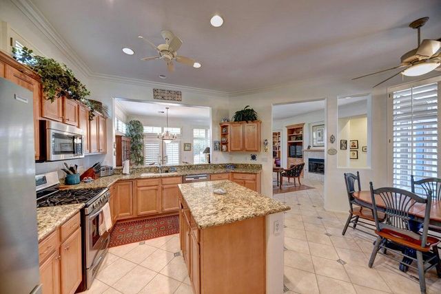 a kitchen with counter top space appliances and seating