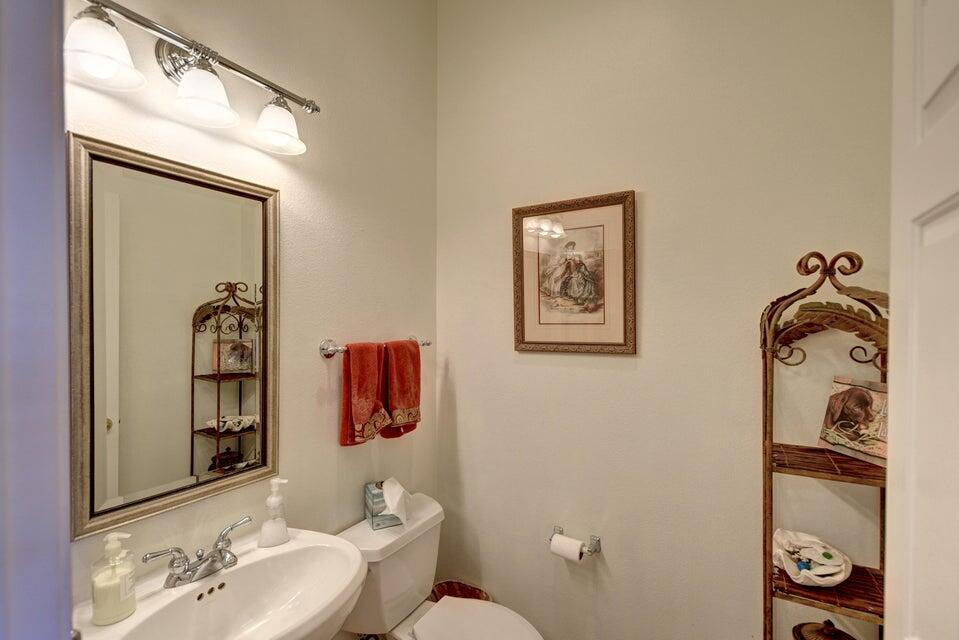 35841 Rosemont Drive Palm Desert, CA 92211 - Photo 9 of 22 a bathroom with a toilet a sink and mirror