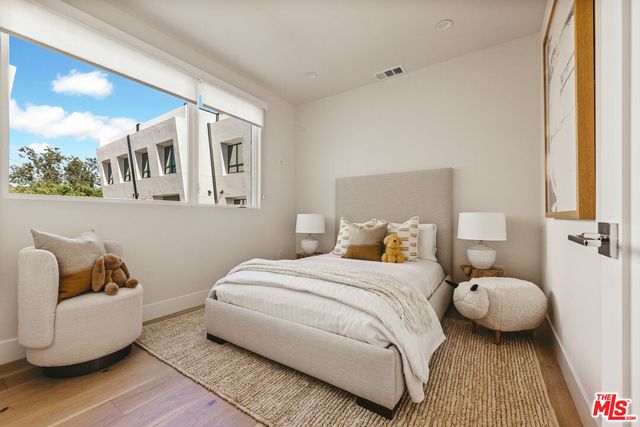 a bedroom with bed and window