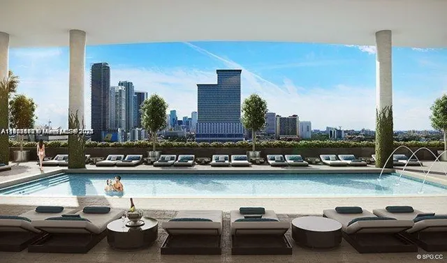 a view of swimming pool with outdoor seating space and a lake view