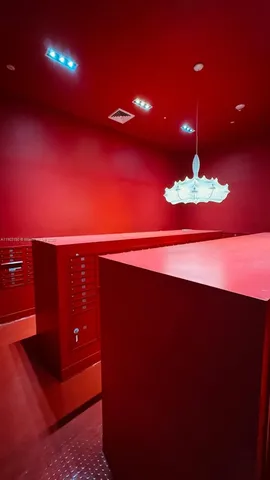 a view of a living room and a kitchen with a sink