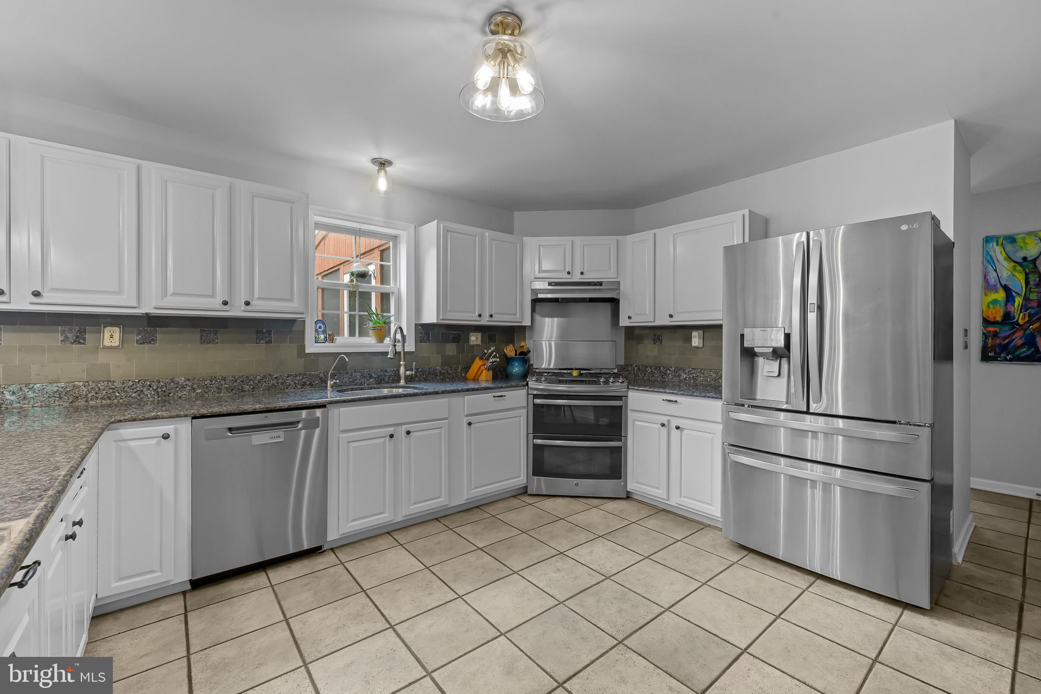 168 Sawmill Road Landenberg, PA 19350 - Photo 15 of 53 a kitchen with granite countertop appliances cabinets and a sink