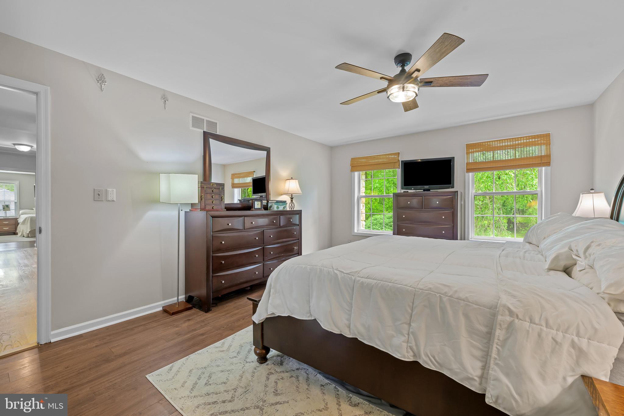 168 Sawmill Road Landenberg, PA 19350 - Photo 17 of 53 a bedroom with a bed and a flat screen tv