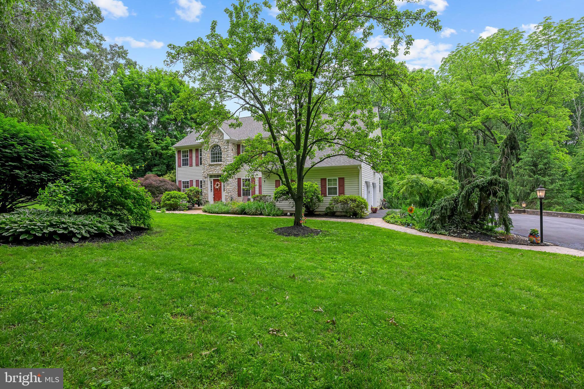 168 Sawmill Road Landenberg, PA 19350 - Photo 2 of 53 a front view of a house with garden