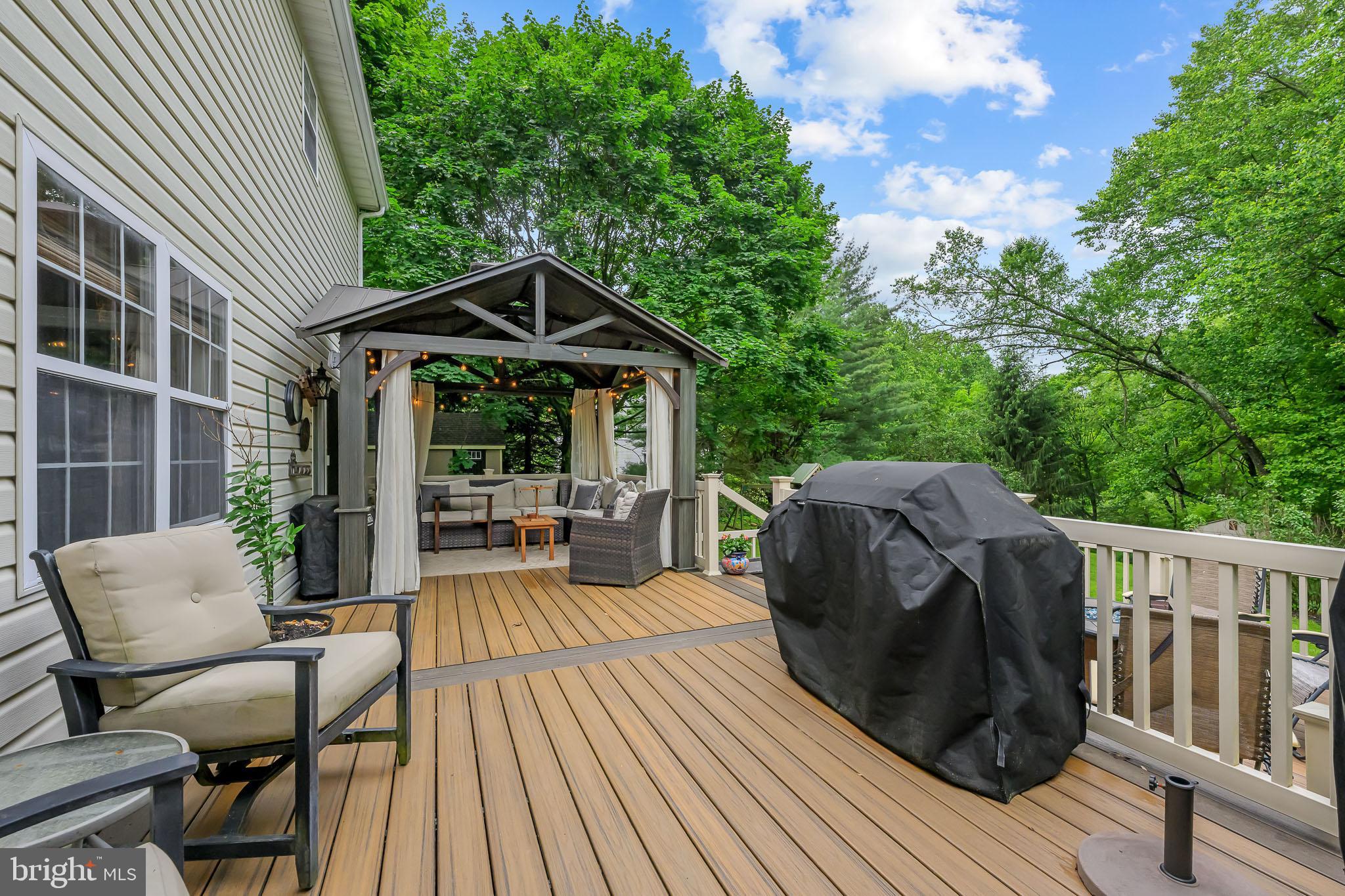 168 Sawmill Road Landenberg, PA 19350 - Photo 35 of 53 a view of deck with table and chairs and wooden floor