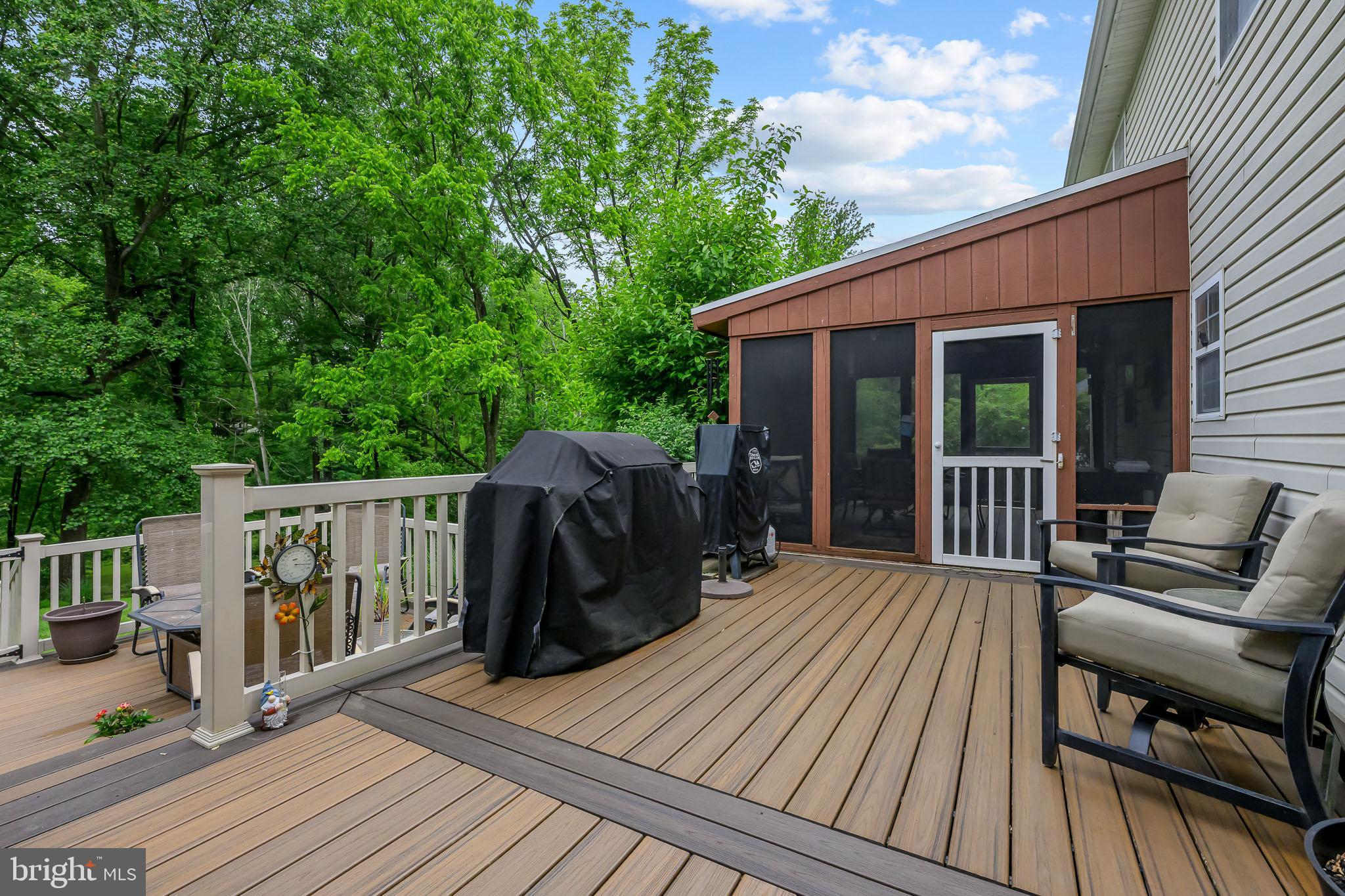 168 Sawmill Road Landenberg, PA 19350 - Photo 36 of 53 a view of a wooden deck with a bench