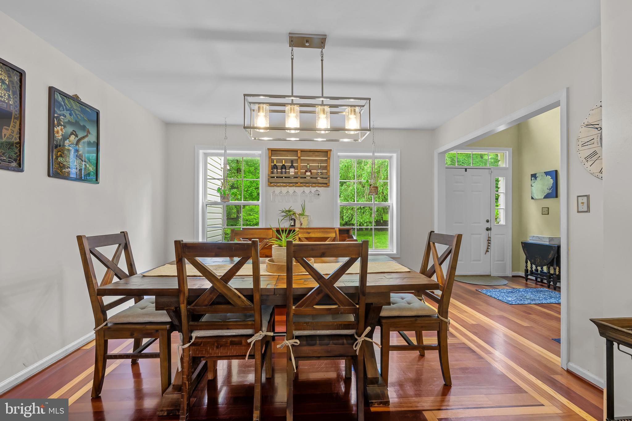 168 Sawmill Road Landenberg, PA 19350 - Photo 7 of 53 a view of a dining room with furniture a chandelier and wooden floor