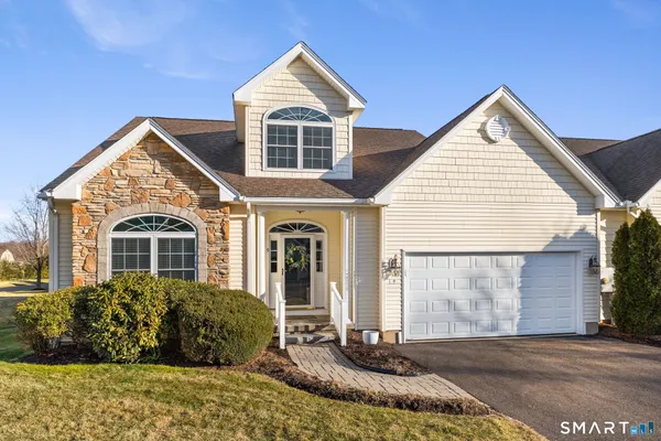 a front view of a house with a yard
