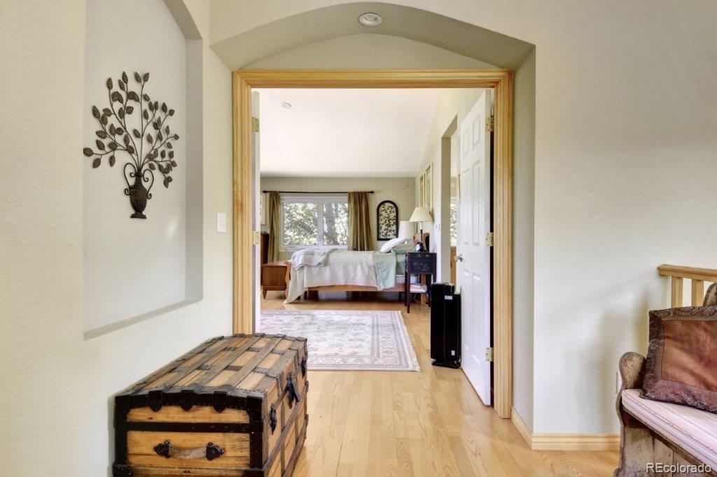 7856 Baseline Road Boulder, CO 80303 - Photo 13 of 40 a view of a bedroom from a hallway