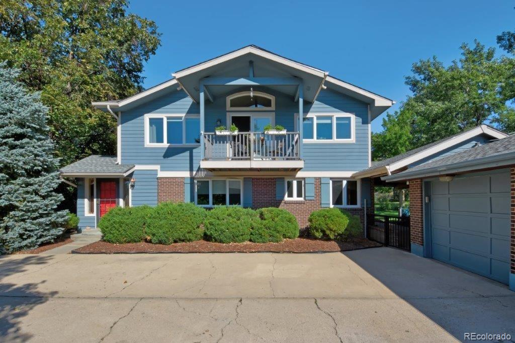 7856 Baseline Road Boulder, CO 80303 - Photo 2 of 40 a front view of a house with a yard and trees