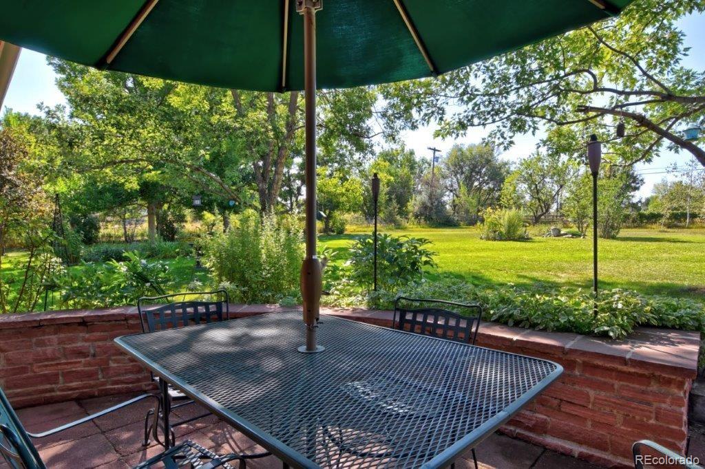 7856 Baseline Road Boulder, CO 80303 - Photo 25 of 40 a view of a backyard with under an umbrella