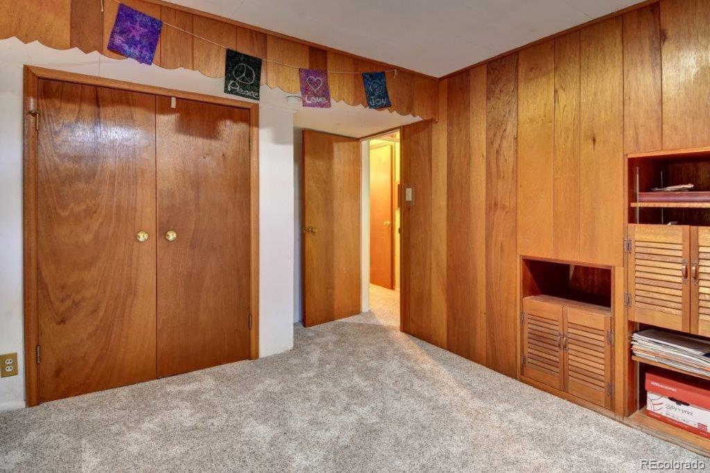 7856 Baseline Road Boulder, CO 80303 - Photo 29 of 40 a view of a room with wooden floor and stairs