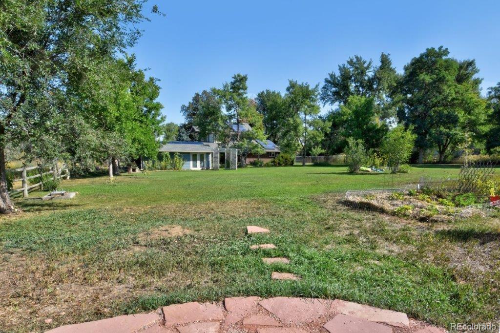 7856 Baseline Road Boulder, CO 80303 - Photo 31 of 40 a view of a house with a yard