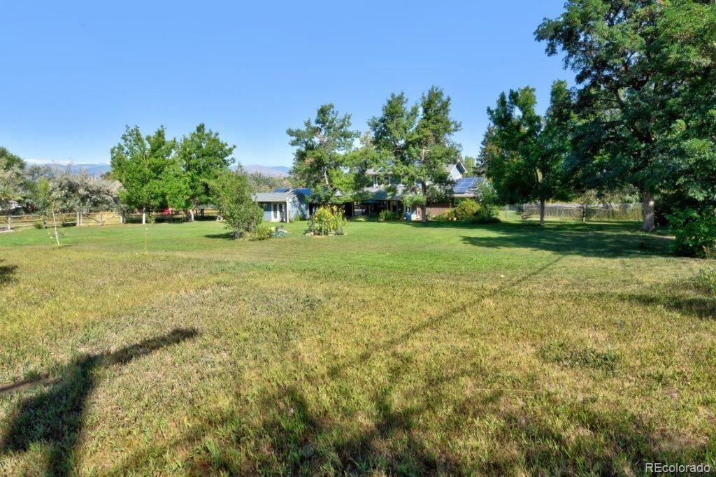 7856 Baseline Road Boulder, CO 80303 - Photo 32 of 40 a yard with lots of green space and trees
