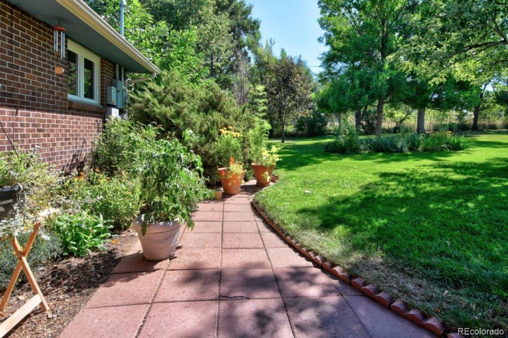 7856 Baseline Road Boulder, CO 80303 - Photo 35 of 40 a view of a back yard with flower garden