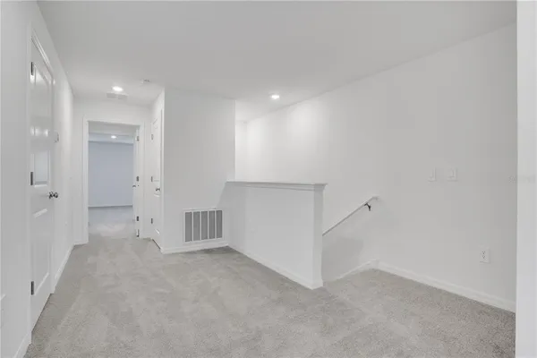 a bedroom with a large bed and a couch