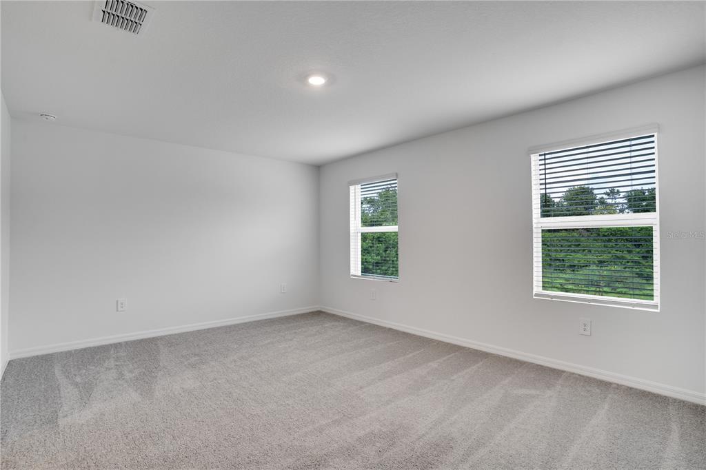 212 27th Street Southeast Ruskin, FL 33570 - Photo 21 of 46 an empty room with windows