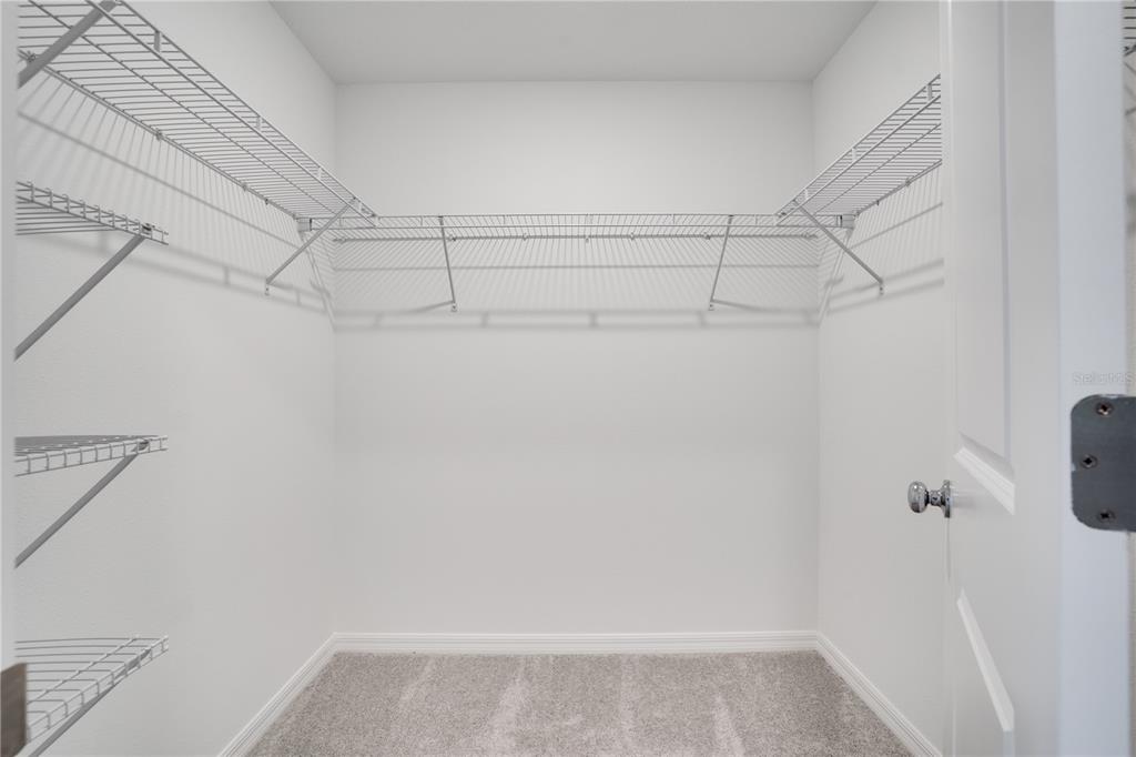 212 27th Street Southeast Ruskin, FL 33570 - Photo 23 of 46 a view of a room with racks on the wall