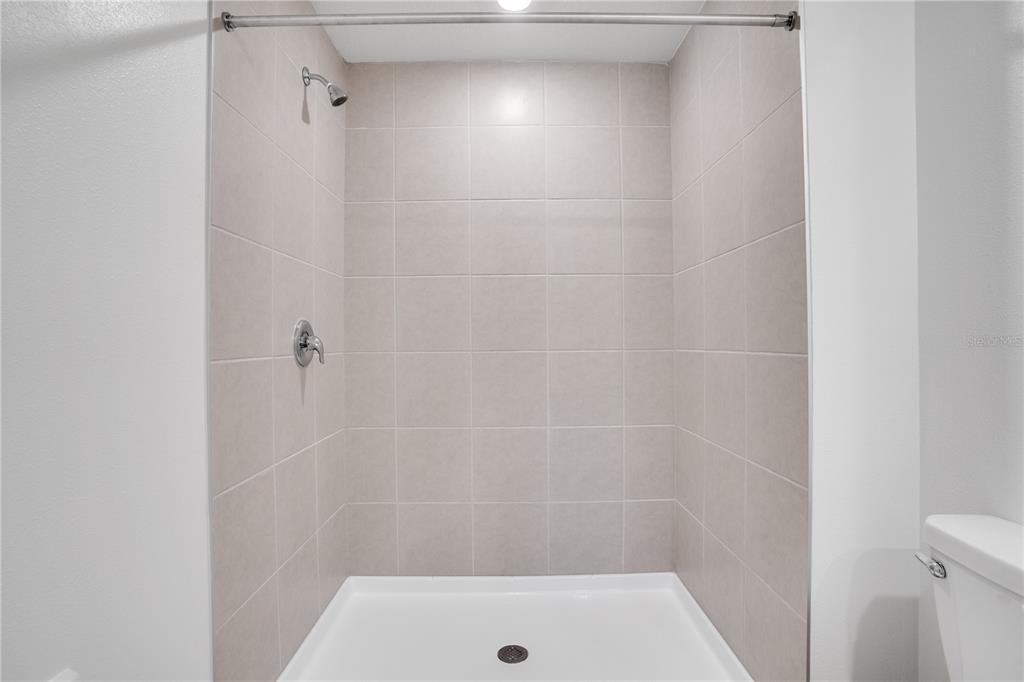212 27th Street Southeast Ruskin, FL 33570 - Photo 26 of 46 a bathroom with a shower
