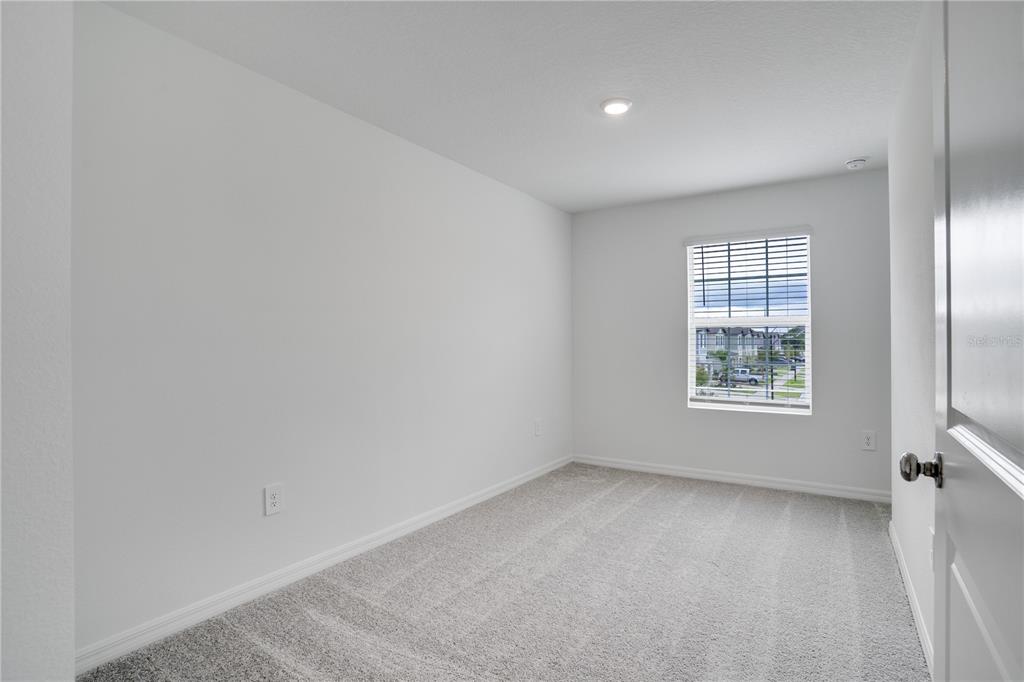 212 27th Street Southeast Ruskin, FL 33570 - Photo 28 of 46 an empty room with a window