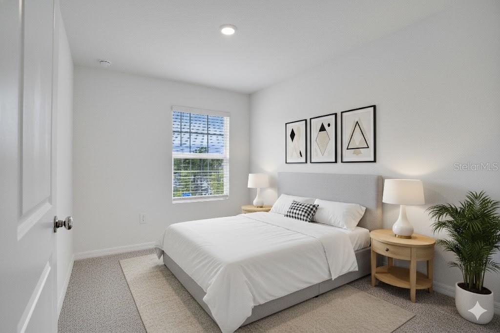 212 27th Street Southeast Ruskin, FL 33570 - Photo 29 of 46 a bedroom with a bed and a potted plant