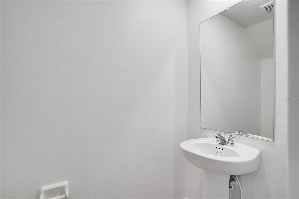 212 27th Street Southeast Ruskin, FL 33570 - Photo 33 of 46 a bathroom with a sink and a mirror