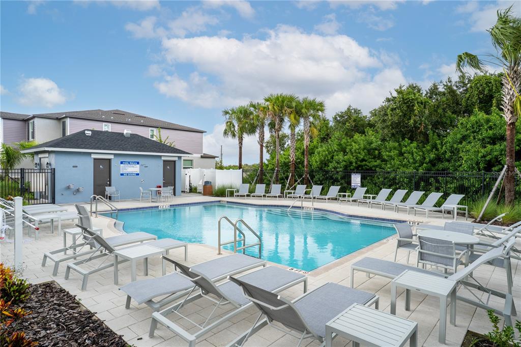 212 27th Street Southeast Ruskin, FL 33570 - Photo 44 of 46 a view of a house with pool and chairs