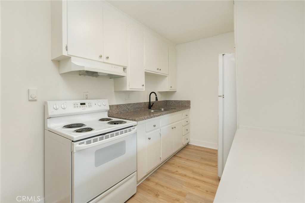 1626 Pine Avenue Long Beach, CA 90813 - Photo 13 of 23 a kitchen with cabinets appliances and a sink
