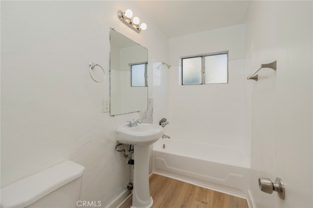 1626 Pine Avenue Long Beach, CA 90813 - Photo 14 of 23 a bathroom with a sink a toilet and shower
