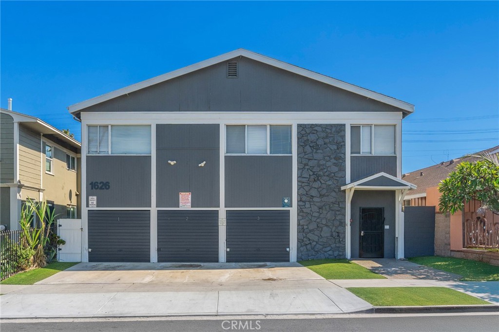 1626 Pine Avenue Long Beach, CA 90813 - Photo 2 of 23 a front view of a house with a garden
