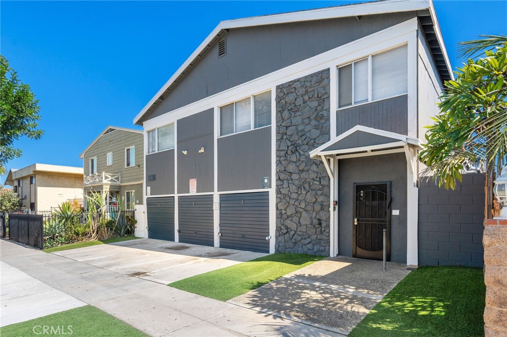 1626 Pine Avenue Long Beach, CA 90813 - Photo 10 of 23 a front view of a house with a yard and garage