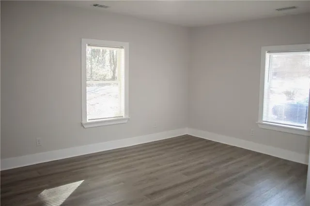 a house that has a tree in front of it