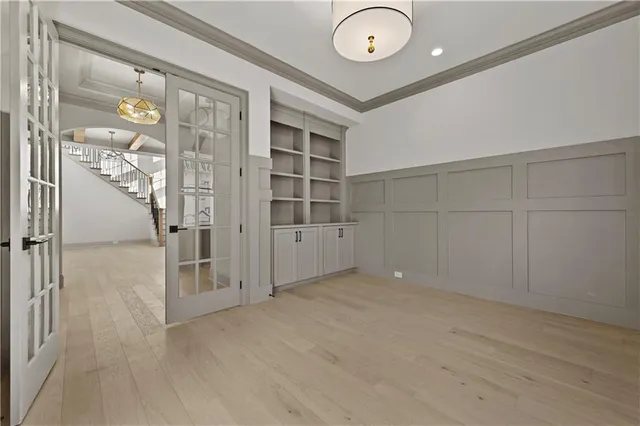 a bathroom with a granite countertop sink vanity mirror and toilet