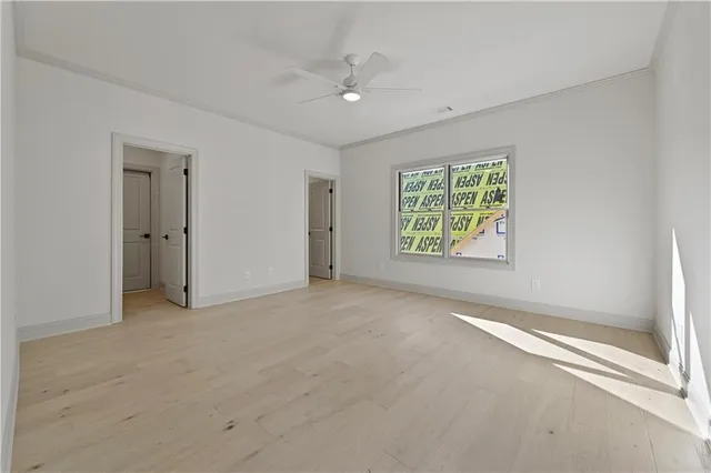 a view of a kitchen with a sink and a refrigerator