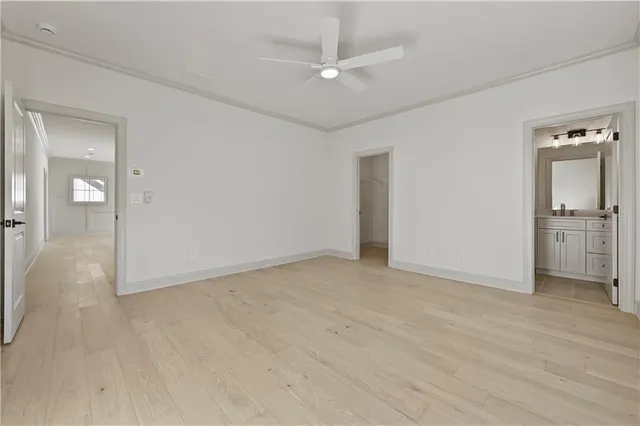 a bathroom with a toilet a sink a tub and mirror
