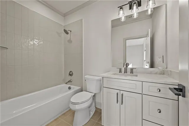 a view of an empty room with a fireplace and a chandelier