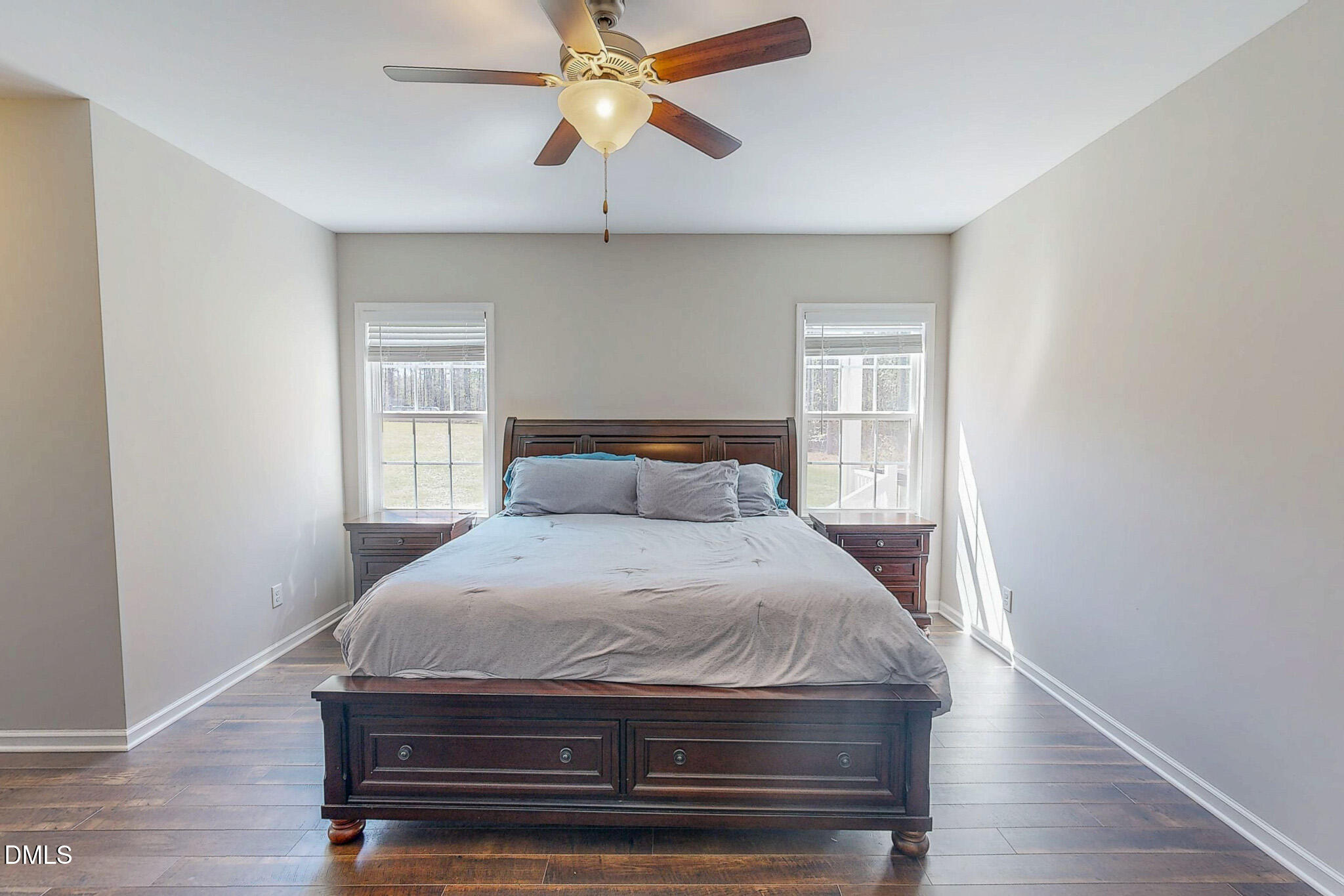 2223 Holeman Ashley Road Timberlake, NC 27583 - Photo 14 of 42 a bedroom with a bed and a chandelier