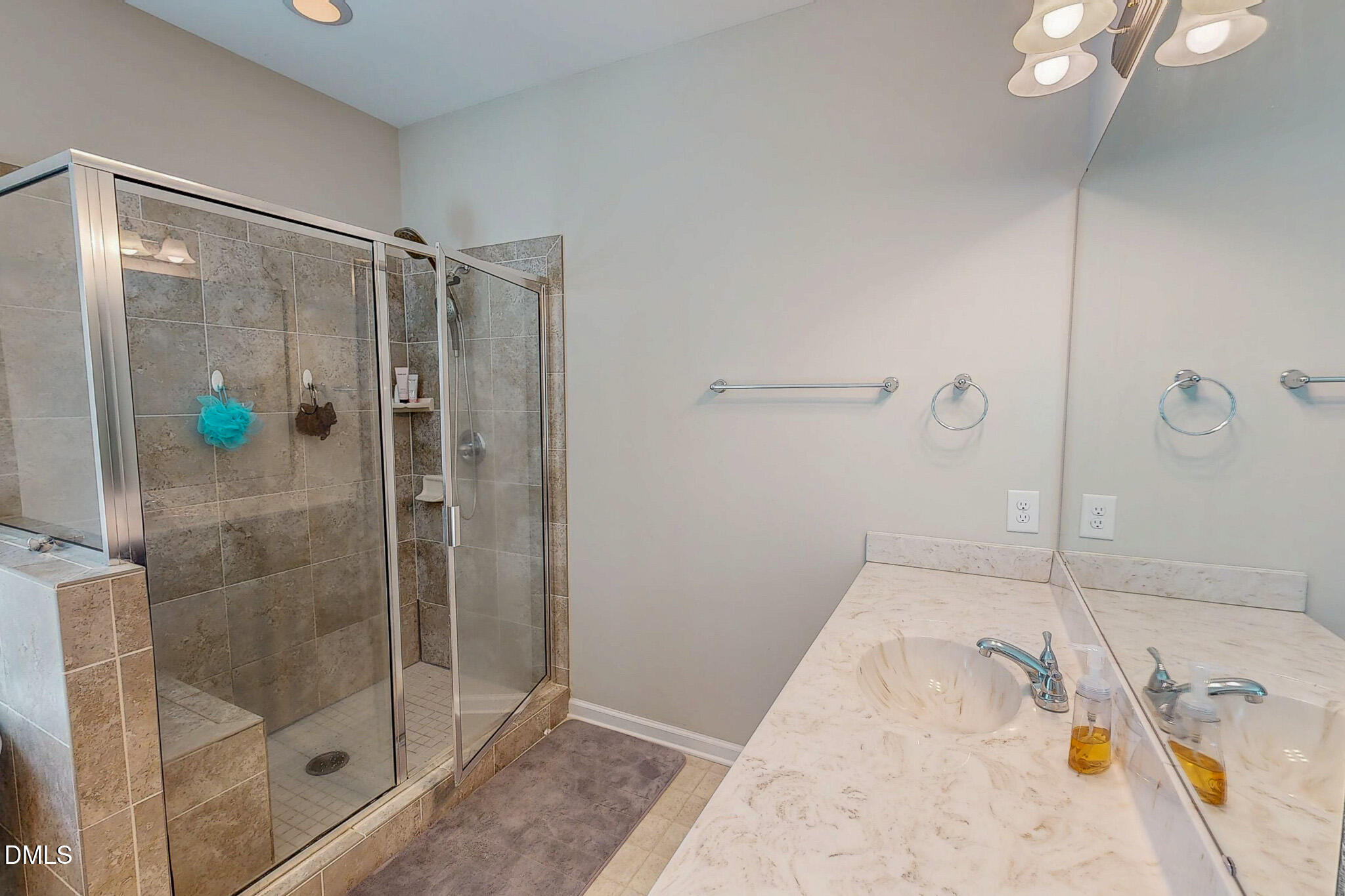 2223 Holeman Ashley Road Timberlake, NC 27583 - Photo 18 of 42 a bathroom with a tub and shower